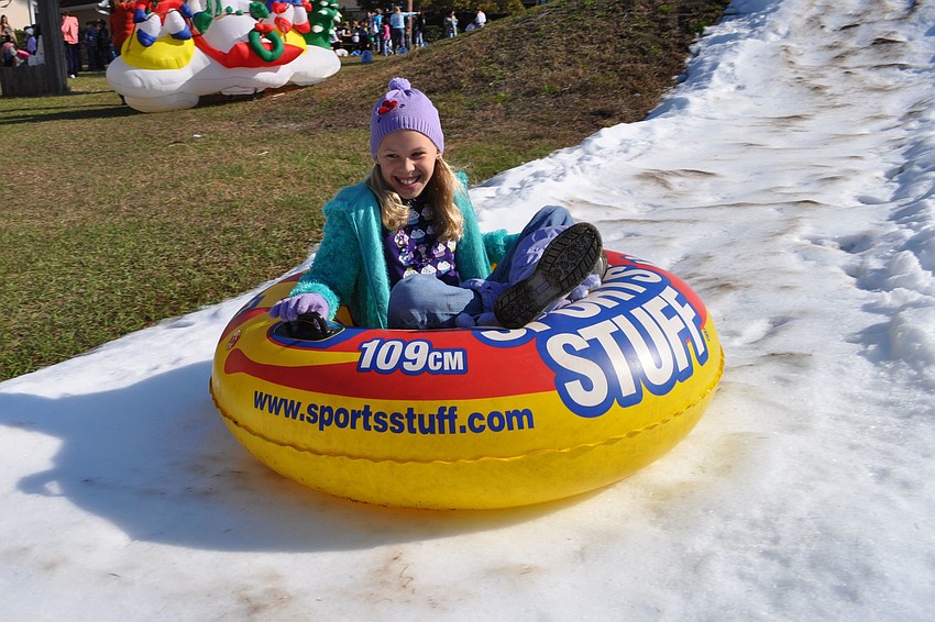 Christa Harding, 10, smiles all the way down the hill.