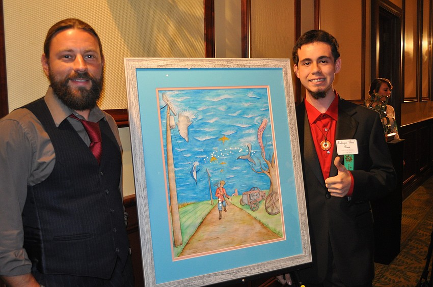 Fabrizio â€œTinoâ€ Peno, a senior at the Manatee School of Arts, wants to be a concept artist for video game design. He showed his piece to Dimitri Jansen.