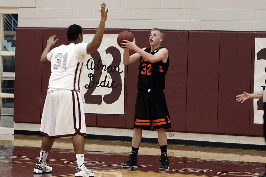 Sarasotaâ€™s Zach Rowden, No. 32, tries to pass the ball to a teammate while Riverviewâ€™s Erick Jaganaath, No. 31, stays close to block the pass.