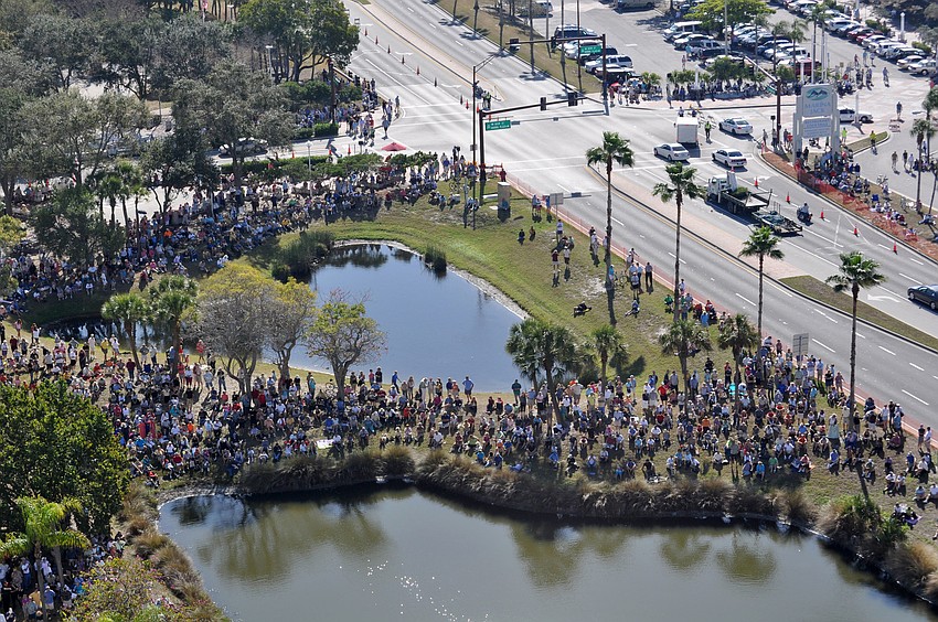 Hundreds of spectators gathered along U.S. 41 to watch.