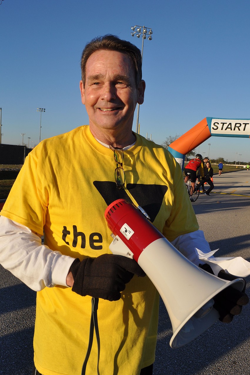 Manatee County YMCAâ€™s Director of Operations Jim Purdy rounded up the runners with the megaphone.