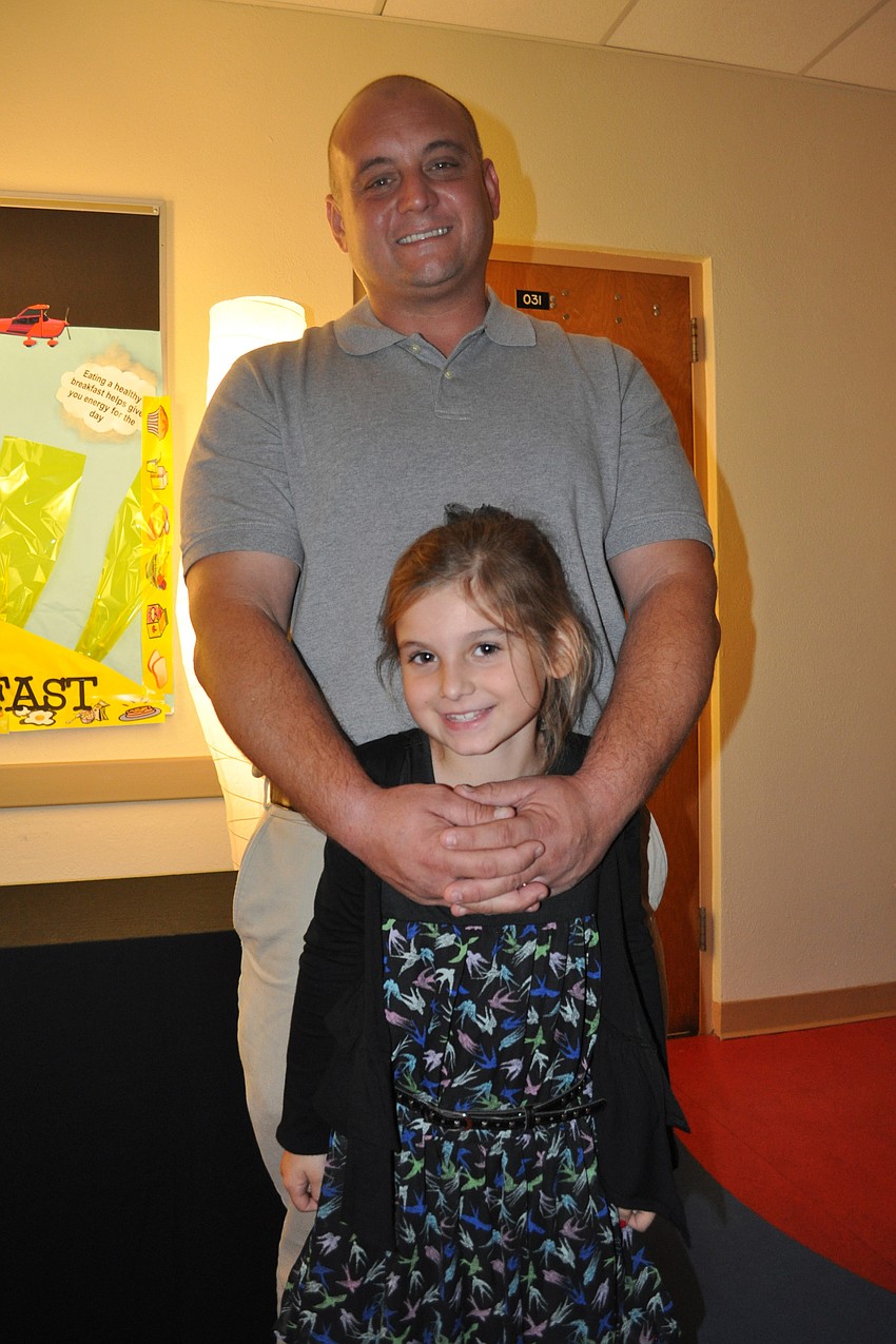 Justin Randolph with his seven-year-old daughter, Madison, at their first father/daughter dance