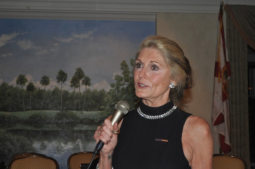 Leslie Hogle accepts the Citizen of the Year award for her late husband, Chief Al Hogle