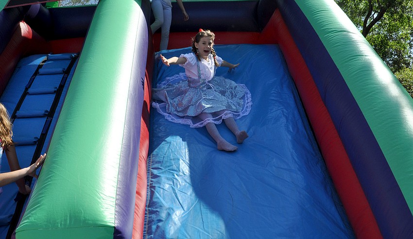 Abby Jo Mount slides down the inflatable slide