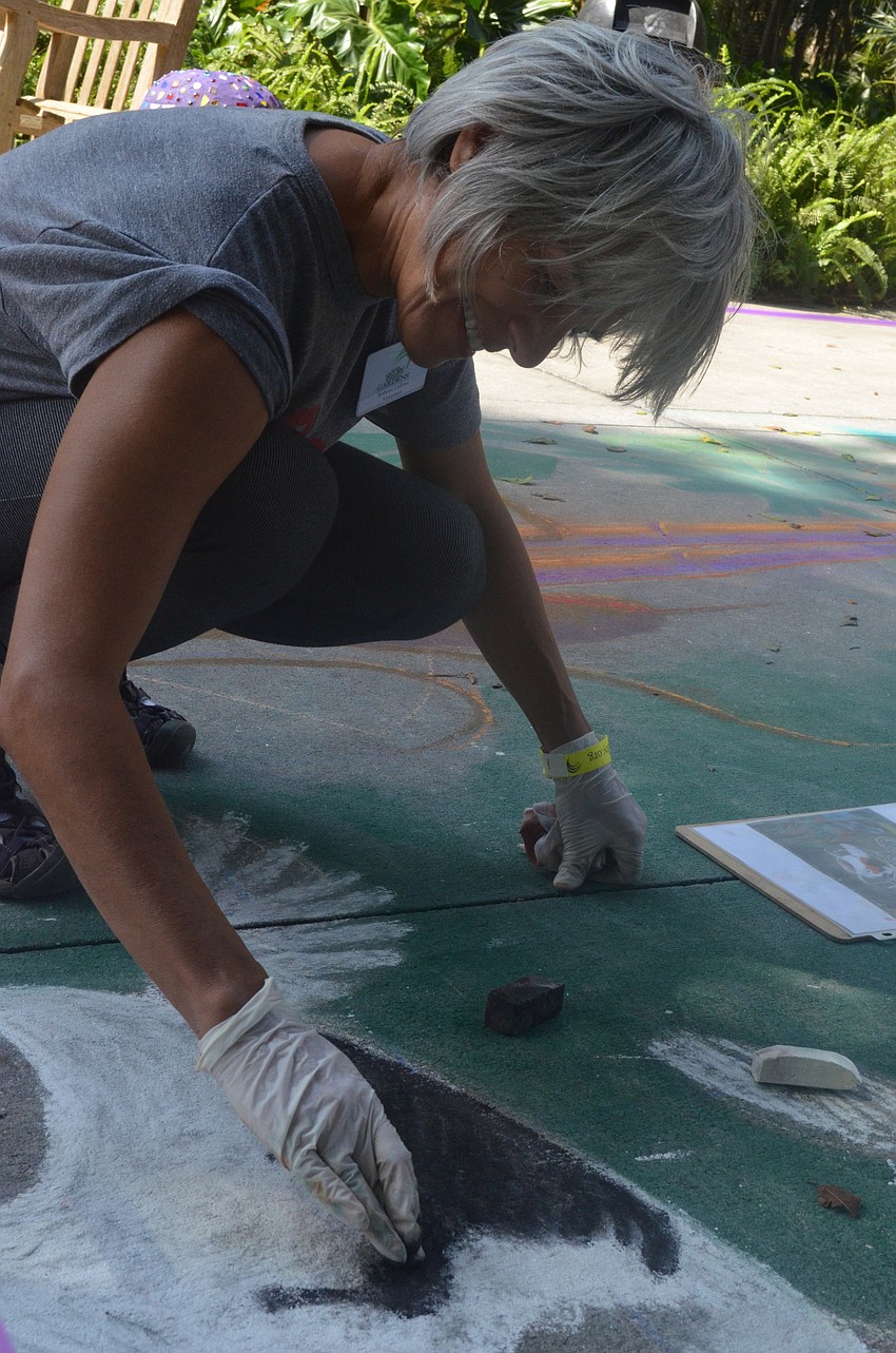 Roberta La Rosa drew chalk art at the Plant and Flower Show.