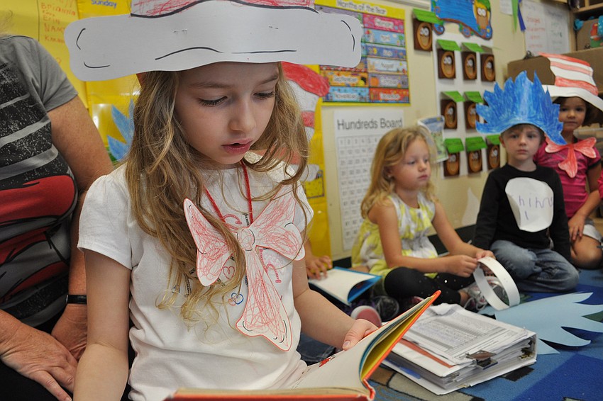 Veronica Densmore reads a Dr. Seuss book to her classmates.