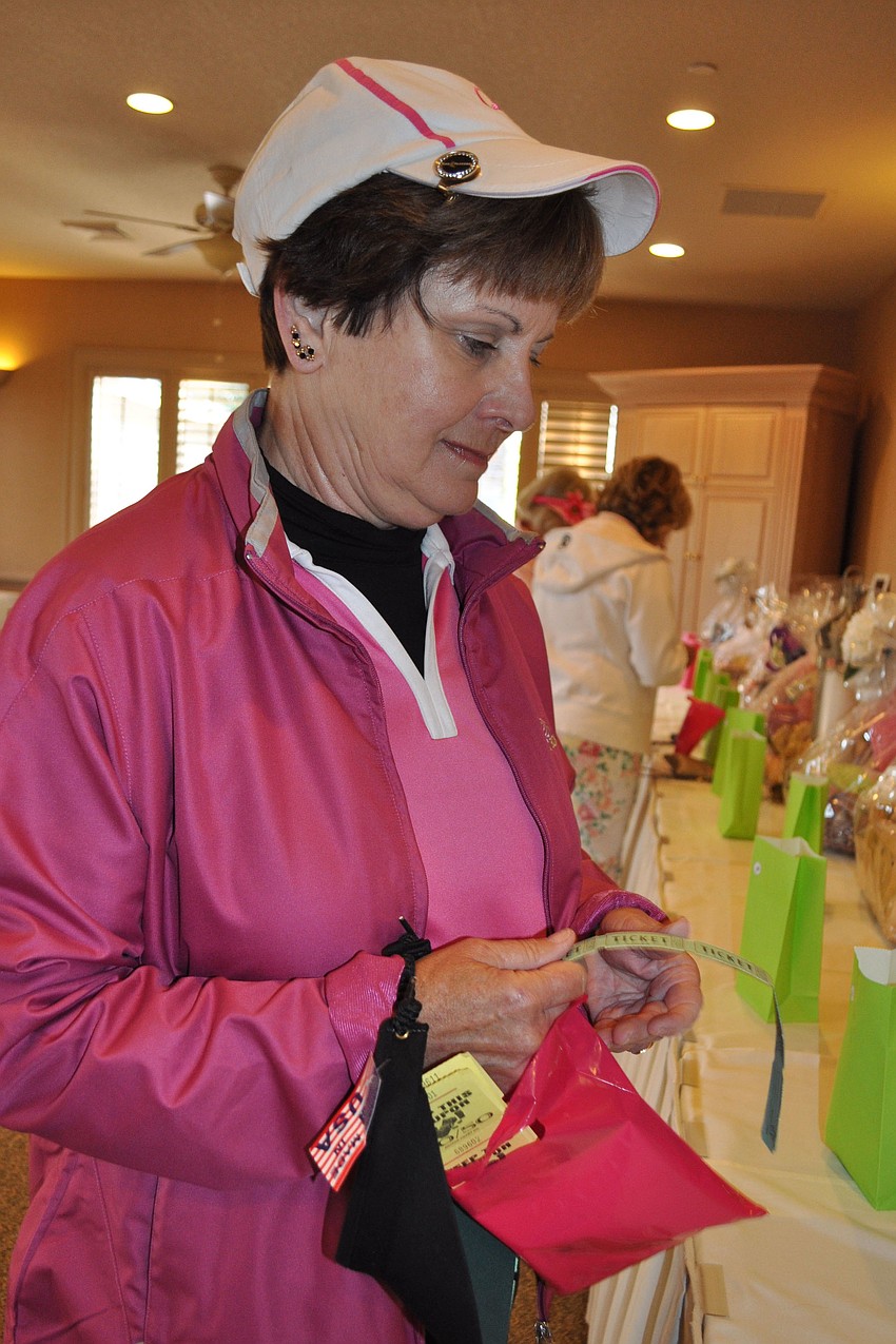 Joyce Matthews checked out silent auction items.