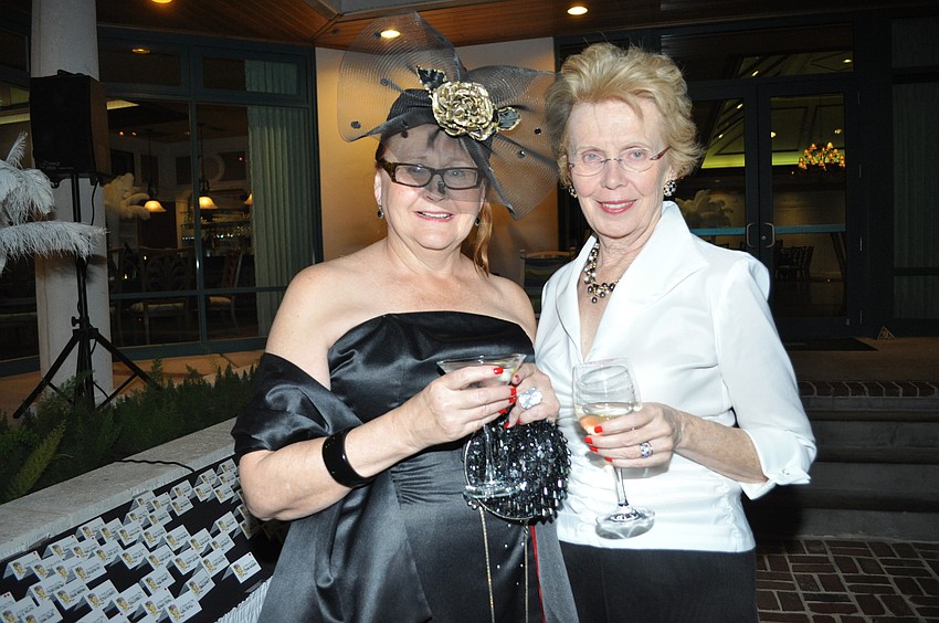 Barbara Pill and Mary Jane Sanacore. Pill got her hat at a Safe Place and Rape Crisis Center fundraiser.