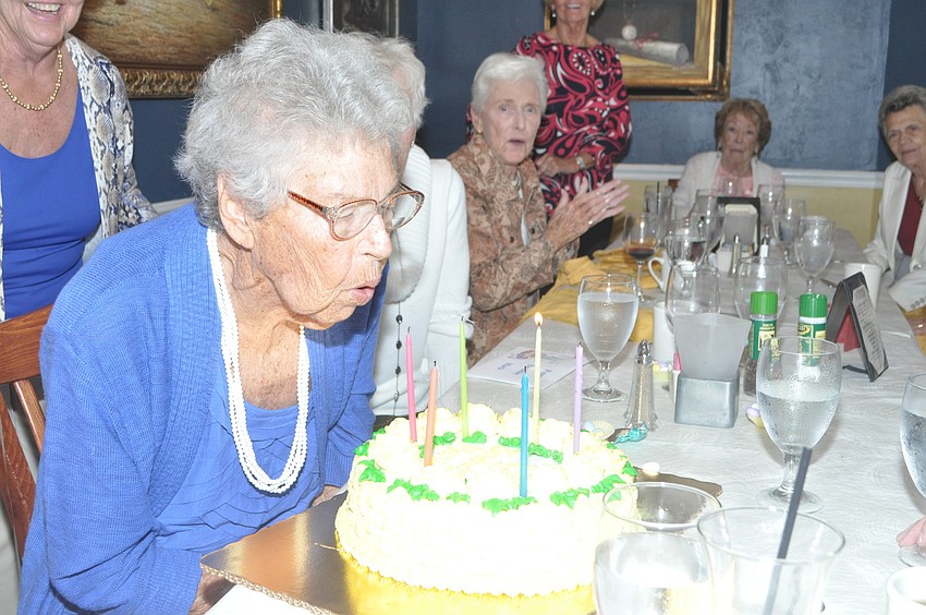 Marle Abramson Kaplan blows out her candles.