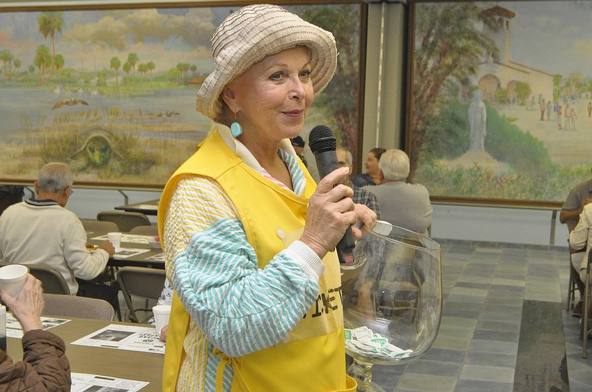 Sylvia Babineau announces a raffle winner.