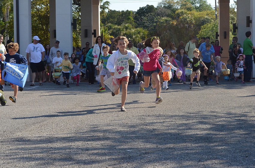 Children stampede toward the eggs.
