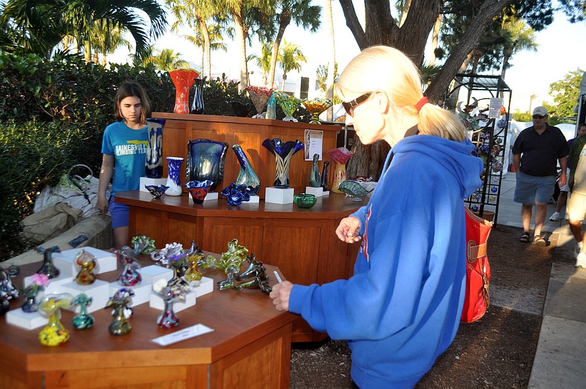 Karen Mann admires bud vases.