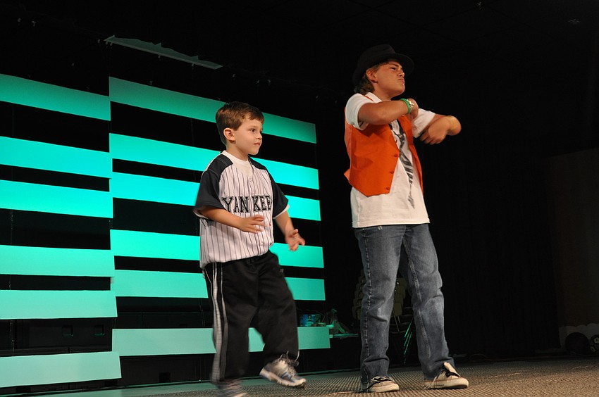 In a cameo performance, five-year-old Nico Juliano, who attends Braden River Elementary, abruptly hopped on stage to dance with Waxler.