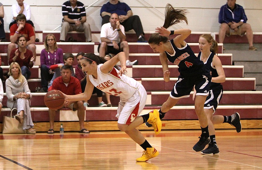 Cardinal Mooneyâ€™s Camille Giardina, No. 22, makes a run with the ball down the court while Indian Rocksâ€™ Hayley Morten, No. 4., and Rebecca Lizotte, No. 11, try to catch up.