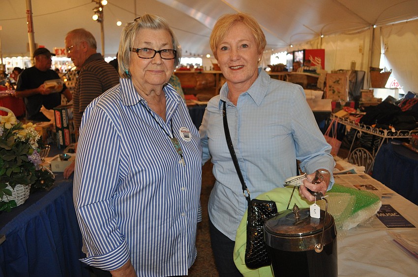 Zoya Kosta and Mary Kohlan with a silver ice bucket they bought at Yia-Yiaâ€™s Attic.
