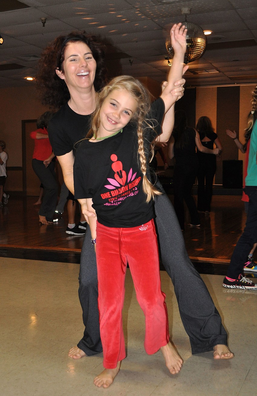 Kimberley Summers dances with her daughter, Cora Gerdes, 7.