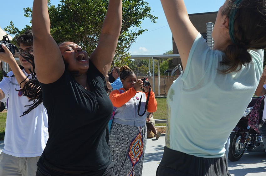 Seniors Siki Kote and Ljubica Nikolic dance with their peers.