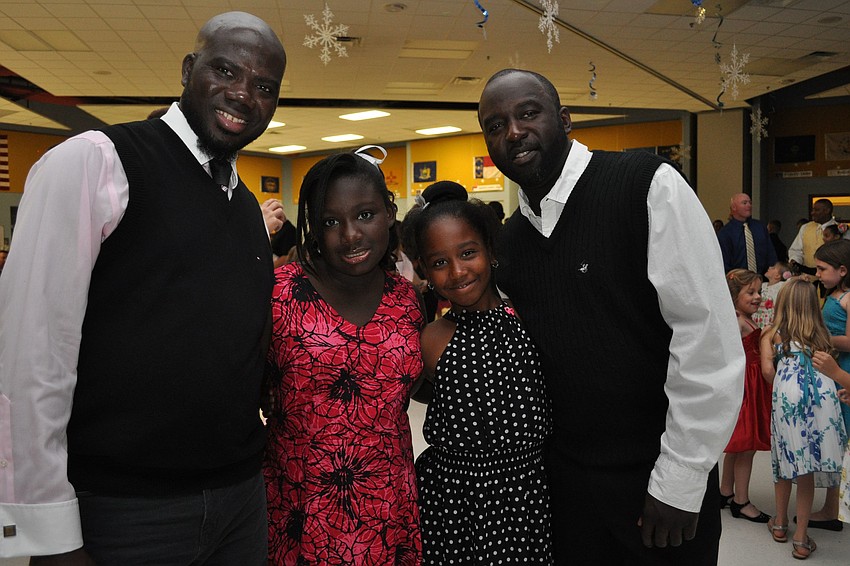 Rotimi Fakayod and his daughter Ayonna Jackson, with Aniya Tribue and her father, Leith Kenon