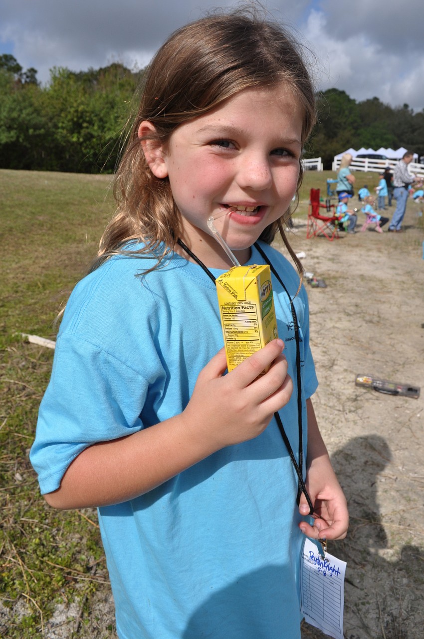 Peyton Knight, 7, took a short break and let her mom, Tiffany, not pictured, fish for a while.
