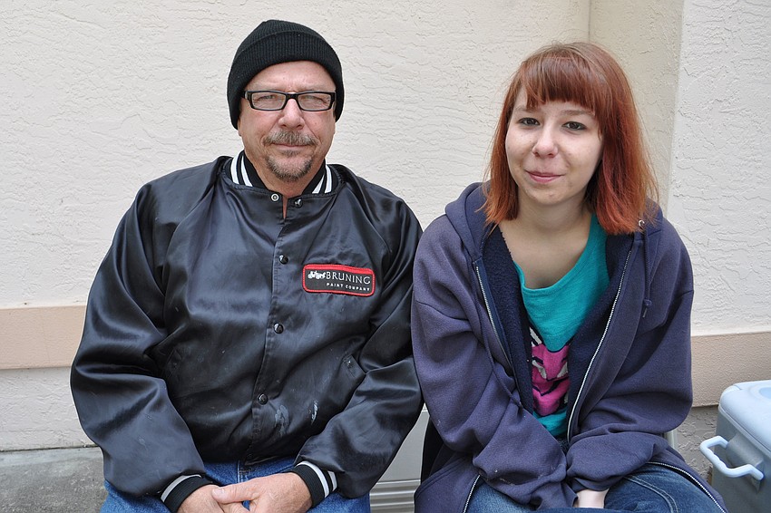 Peter Holtslander and his daughter, Kailey, grilled hot dogs for the crowd.