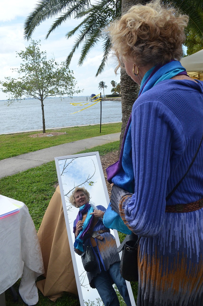 Jane Hamlin browses Anna Champaignâ€™s hand-painted silk scarves.