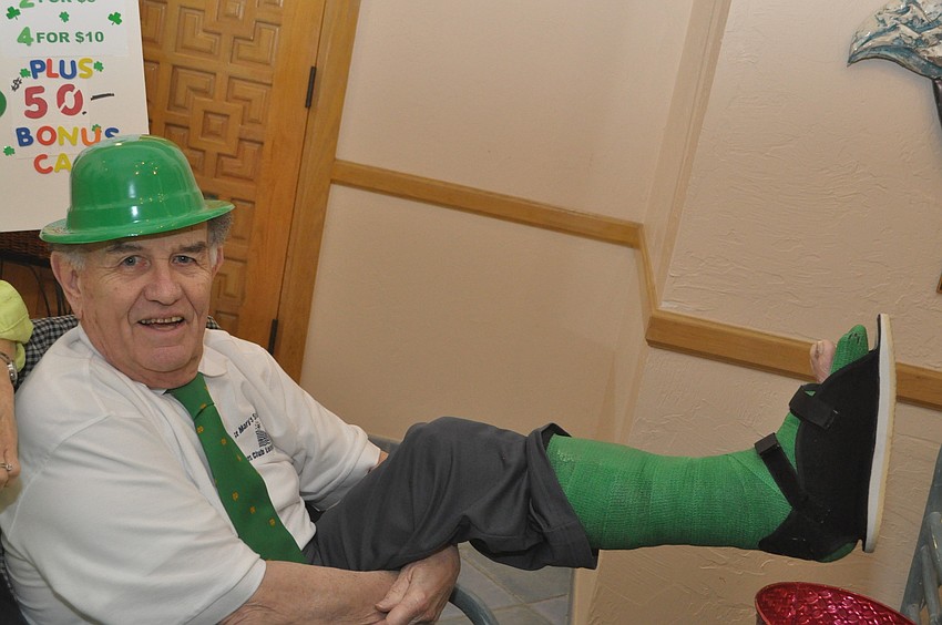 Jack McManus sports a green cast after his ankle replacement surgery.