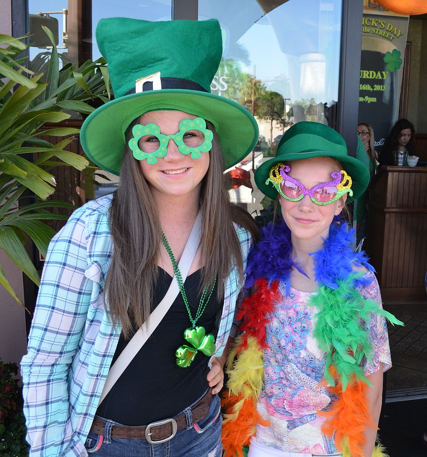 Alexandra Fedack and her sister, Emily, prepare to pose in a photo booth.