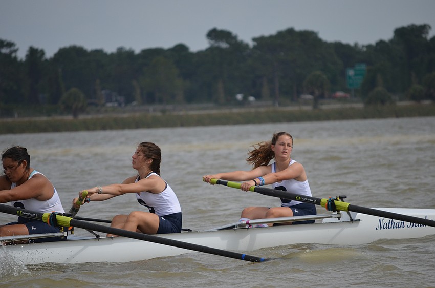Sarasota Crew rowers Logan Gerhardt, Sidney London and Libby Oliveri row to the starting line.