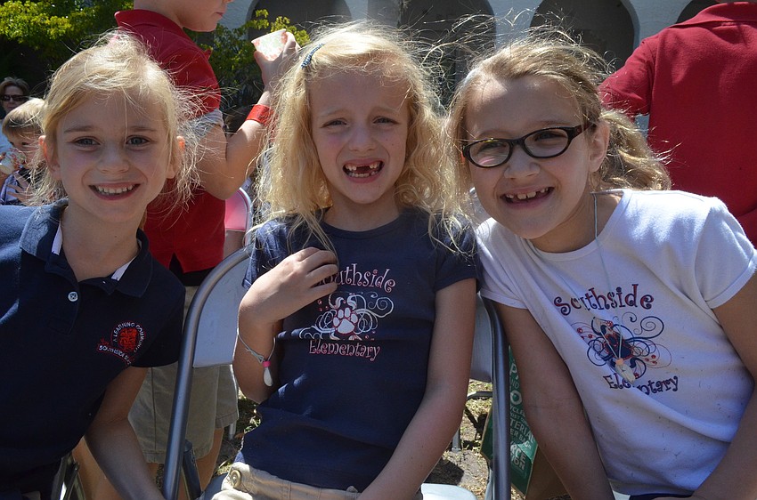 First graders Esmee Dieckman, Serena Beaty and Kylie Giasson get ready to watch a presentation from the Sarasota Jungle Gardens.