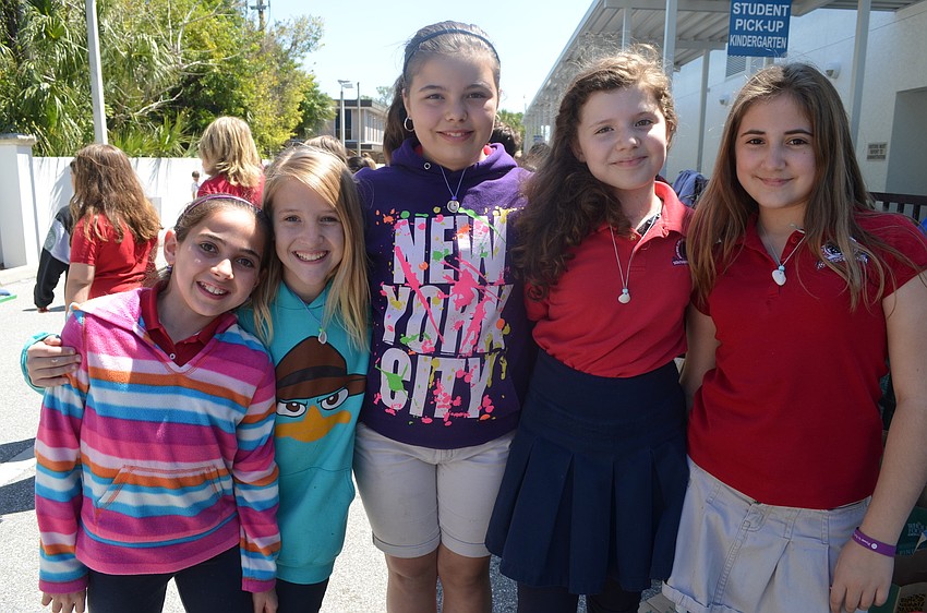 Fifth graders Skyler Metnick, Victoria Meyer, Abby Nations, Nicole Jolly and Lydia Wachob get ready to participate in the corn hole toss.