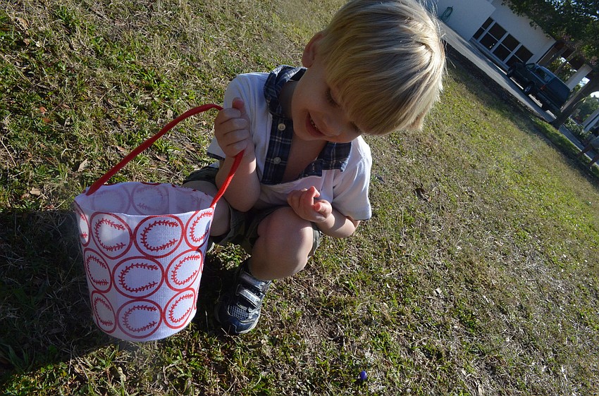 Tommy Schultz searches for Easter eggs.
