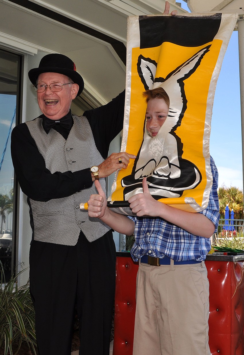 Magician Stevie Dee turns Ben Elliot, 12, into a bunny rabbit.