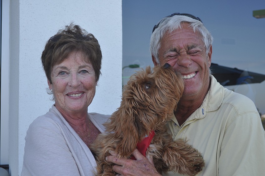 Susan and Michael Master, with Maggie, a mini labradoodle