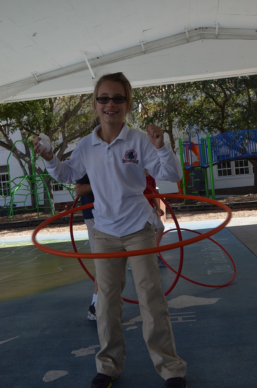 Eve Davis shows off her hula skills.