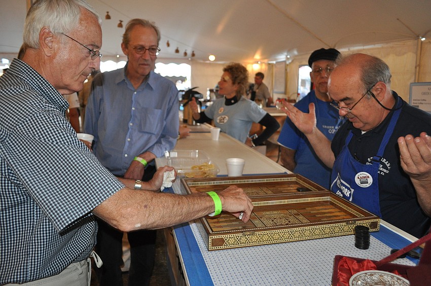 Demetri Lignos and Kaiser Sayeg played backgammon. Sayeg won.