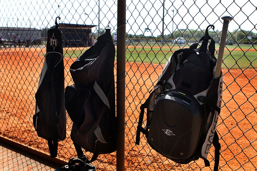 Players hung their bags up in one of the dugouts prior to their first game of the Spring season.