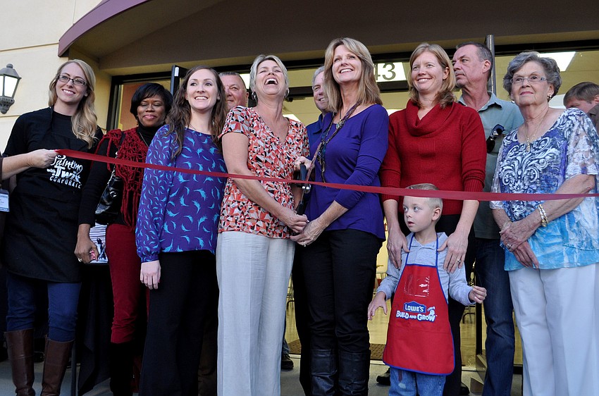 Owners, Hope Kinney and Sheri Penxa, cut the ribbon at the grand opening of â€œPainting with a Twist.â€