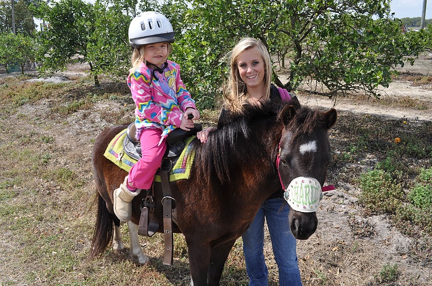 Marisol Renney rode a horse with the guide of Shelby Manson.