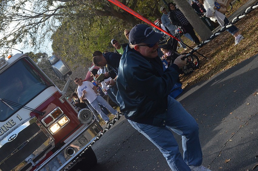 Chief Mike Tobias gives it all heâ€™s got at the Pumper Pull Challenge.