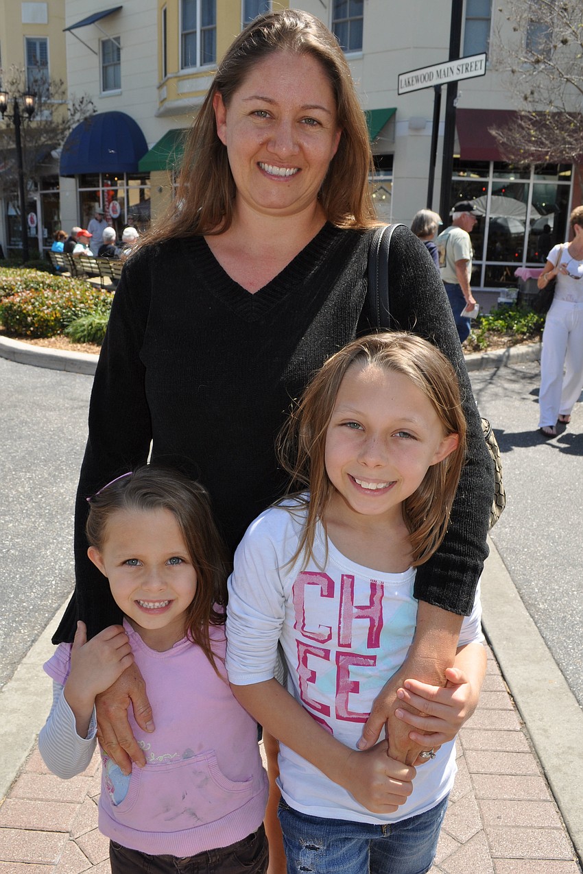 Stacey Keene and her daughters, Shyanne, 5, and Sarah, 8, visited art booths before heading to lunch.