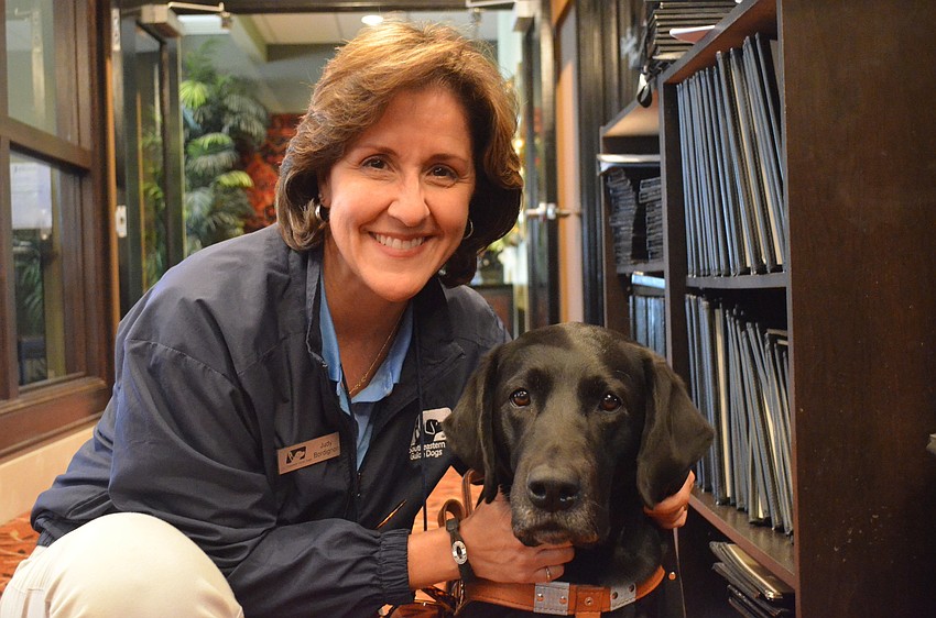 Southeastern Guide Dog trainer Judy Bordignon with her dog Jaime. Jaime was once a breeder dog for Southeastern Guide Dogs but has since retired and is now a demo dog.