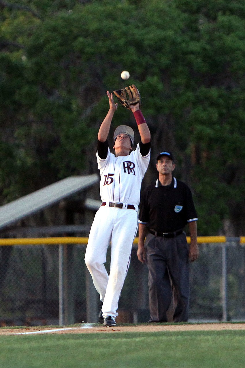 Riverviewâ€™s Corey Whitt, No. 15, catches a ball in the outfield.