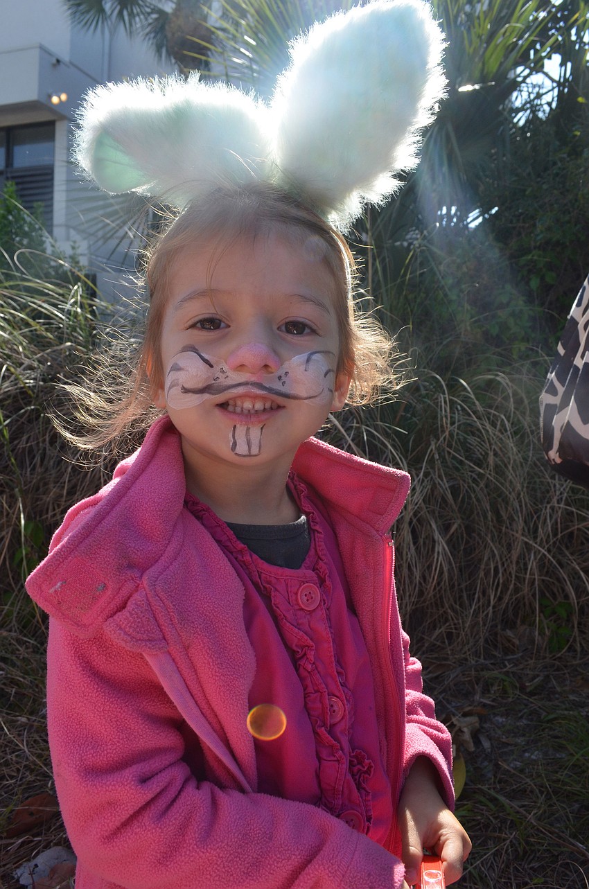 Noemi Heimgartner just moved to Sarasota with her family from Switzerland. She waits in line to search for Easter eggs.