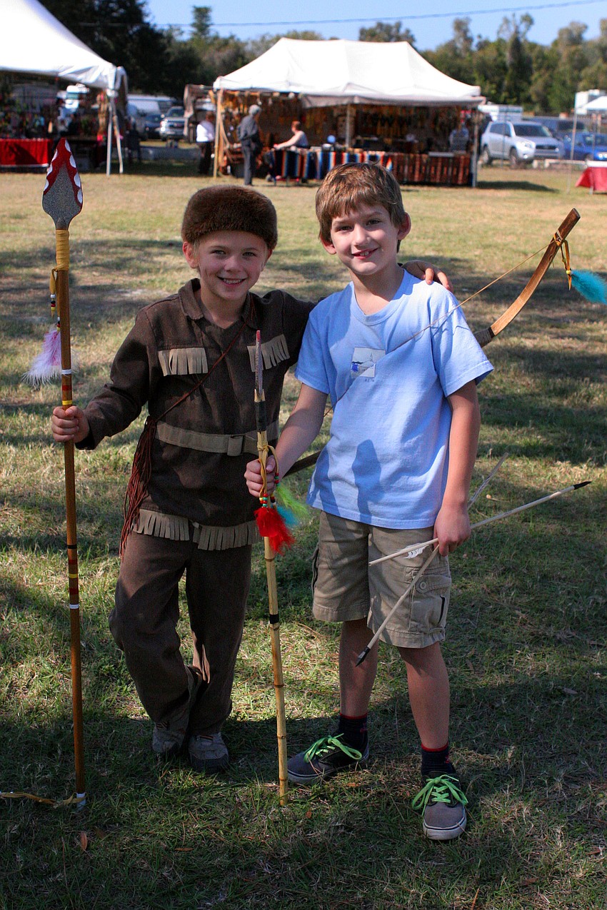 Jack Schmitt, 7, and Jack Sugar, 8, show off all the Native American items they bought while at the Native American Indian Festival Friday, Jan. 25, at the Sarasota Fairgrounds.