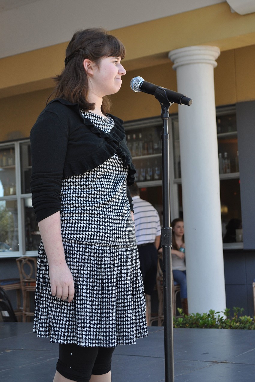 Booker Middle School student Emma Diner sang 