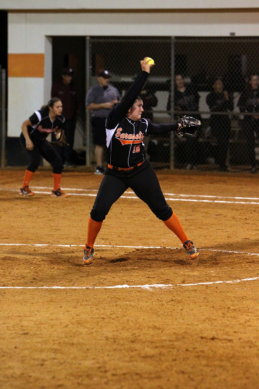Sarasotaâ€™s Sarah Jenkins, No. 18, winds up to pitch.