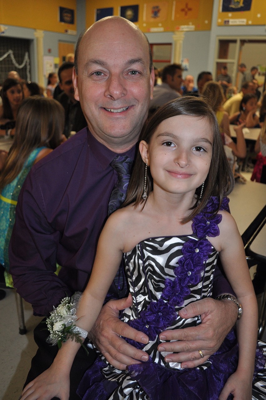Robert MacDonald twirled his daughter, Rio, 10, on the dance floor.