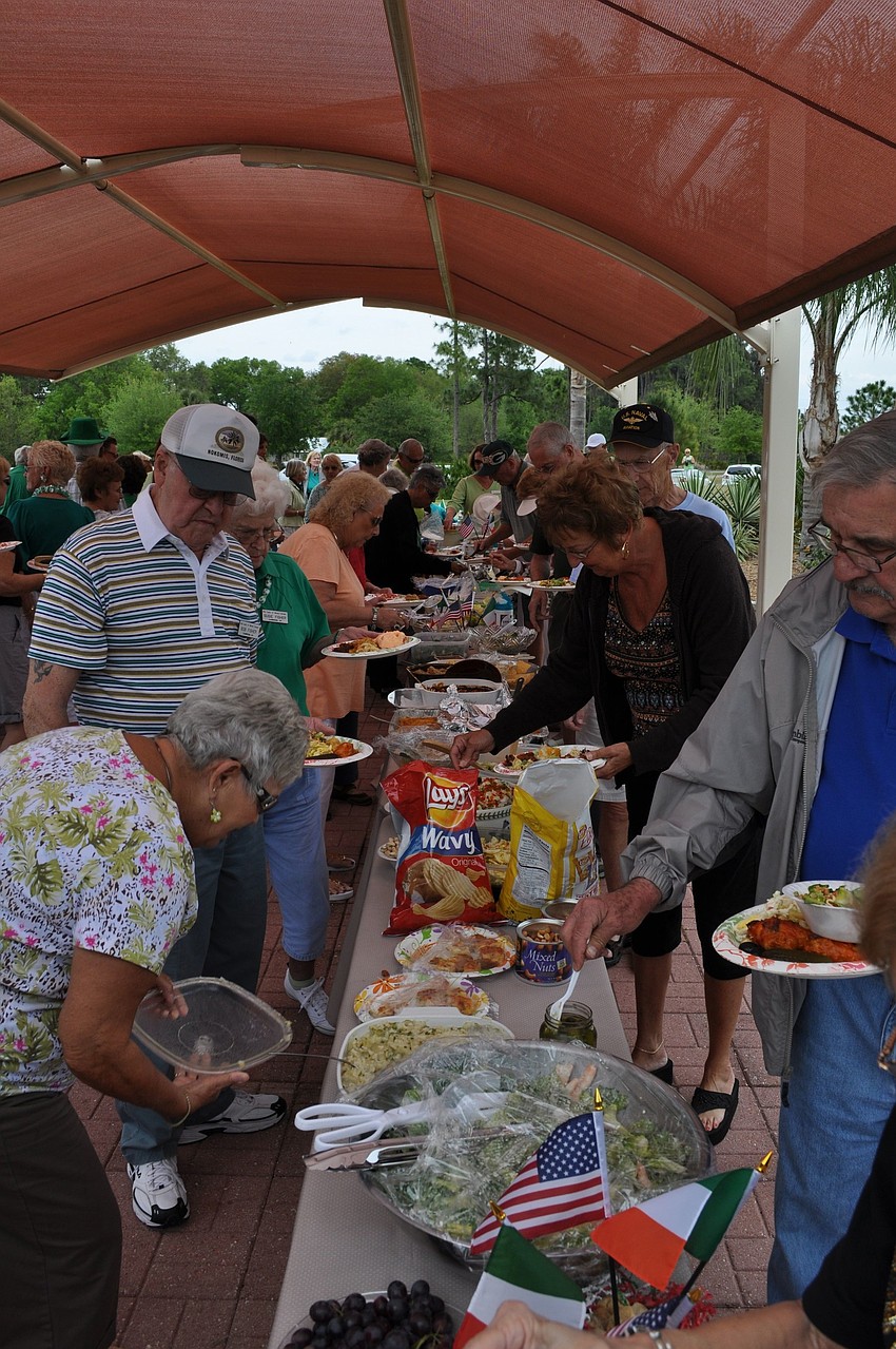 People made their way down the large tables to fill their plates with food.