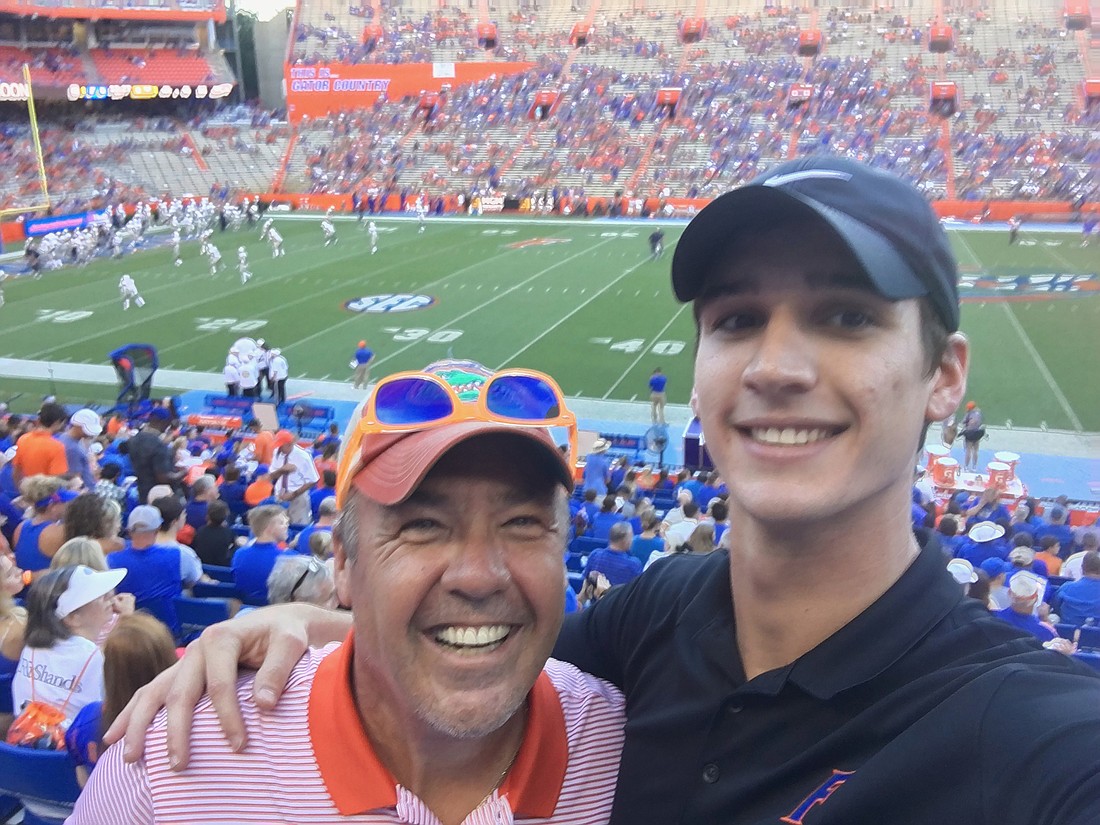 Christopher Spiro at Ben Hill Griffin Stadium with his so, CJ, for a Florida Gators football game. Courtesy Christopher Spiro