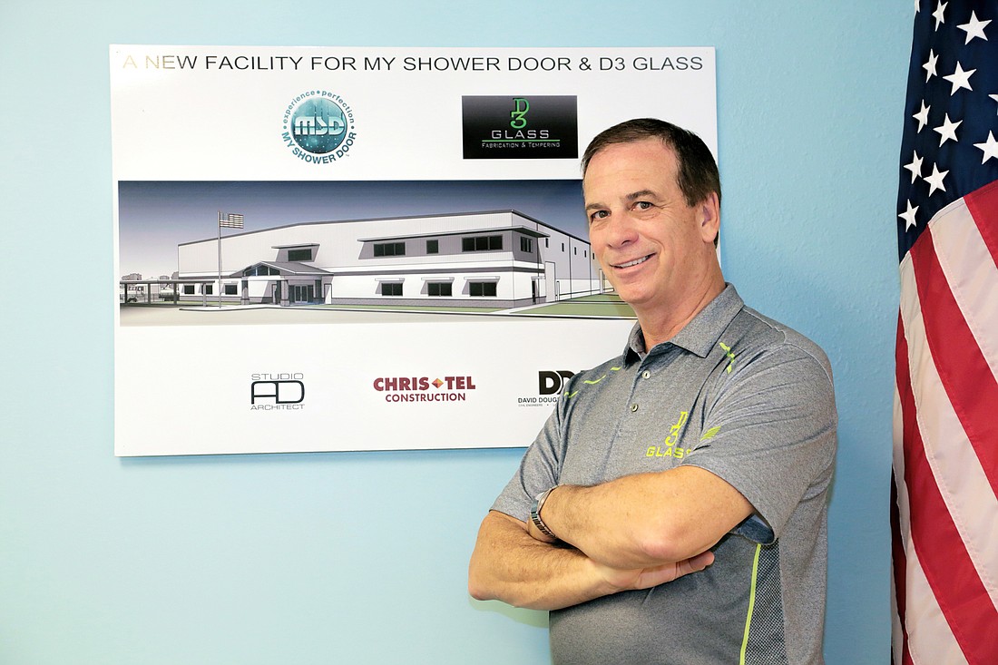My  Shower Door founder and partner Bill Daubmann shows off a rendering of the company&#39;s planned new headquarters and manufacturing plant in Fort Myers. Stefania Pifferi photo